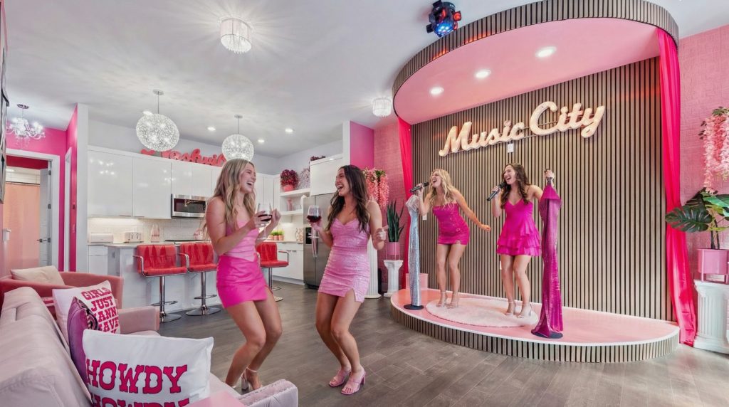 The Pink Honky Tonk karaoke stage in Nashville with friends singing and dancing, perfect for Nashville travel tips.