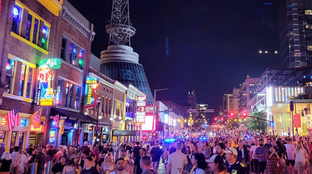 Crowds enjoying Broadway nightlife on a Nashville girls trip.